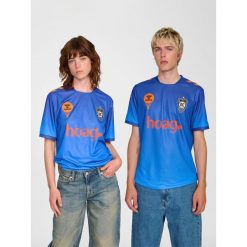 Koszulka domowa Hummel Orange County 2025/26. Białe bluzki damskie Hummel, bez wzorów, sportowe, bez kołnierzyka, bez ramiączek. Za 340.00 zł.