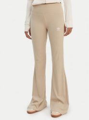 Adidas Legginsy Essentials KD3850 Beżowy Flared Leg. Brązowe legginsy damskie Adidas, bez wzorów, z wiskozy. Za 219.99 zł.
