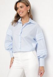 Jasnoniebieska Koszula z Bawełną Ozdobiona Szerokimi Rękawami Edimelia. Niebieskie koszule damskie Born2be, m, bez wzorów, z bawełny, eleganckie, bez kołnierzyka, bez ramiączek. Za 89.99 zł.