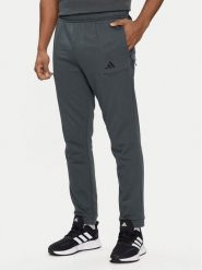 Adidas Spodnie dresowe Pump Workout IT4311 Zielony Regular Fit. Zielone spodnie sportowe męskie Adidas, m, bez wzorów, z bawełny, na fitness i siłownię. Za 229.99 zł.