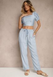Jasnoniebieskie Spodnie z Bawełną High Waist Ozdobione Wiązaniem Calwia. Niebieskie spodnie materiałowe damskie Renee, na lato, bez wzorów, z bawełny, eleganckie, z podwyższonym stanem. Za 49.99 zł.