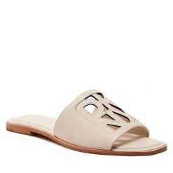 Klapki DKNY. Klapki damskie DKNY, bez wzorów, bez obcasa, bez zapięcia. Za 449.99 zł.