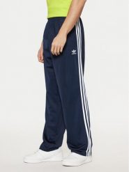Adidas Spodnie dresowe adicolor Classics Firebird IM9471 Granatowy Regular Fit. Niebieskie spodnie sportowe męskie Adidas, m, bez wzorów, z dresówki. Za 219.99 zł.