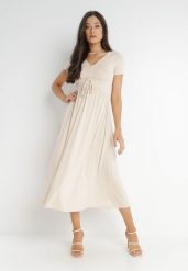 Jasnobeżowa Sukienka Ionene. Brązowe sukienki damskie Born2be, na co dzień, na lato, l, bez wzorów, bez kołnierzyka, bez ramiączek, midi, proste. Za 119.99 zł.