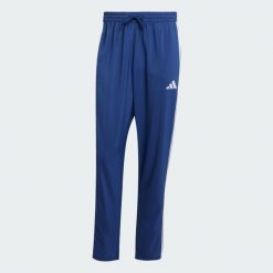 Spodnie Essentials 3-Stripes Stanford Open Hem. Białe buty sportowe męskie Adidas, bez wzorów, z materiału, bez zapięcia, na fitness i siłownię. Za 179.00 zł.