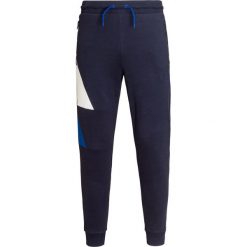 Spodnie dresowe EA7 EMPORIO ARMANI. Niebieskie spodnie sportowe męskie EA7 Emporio Armani, bez wzorów, climacool (adidas). W wyprzedaży za 264.00 zł.