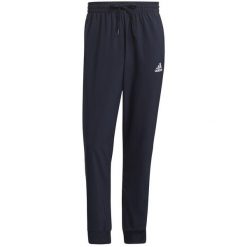 Spodnie męskie adidas Essentials Tapered Cuff 3 Stripes. Czarne spodnie materiałowe męskie Adidas, bez wzorów, z polaru. Za 182.00 zł.