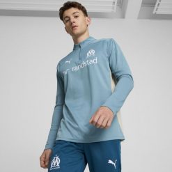 Top piłkarski Puma Olympique de Marseille 24/25. Bluzy męskie Puma, l, bez wzorów, z materiału, sportowe, bez ramiączek, bez kaptura. Za 349.99 zł.