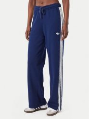 Adidas Spodnie dresowe Firebird KW2605 Niebieski Regular Fit. Niebieskie spodnie dresowe damskie Adidas, bez wzorów, z dresówki. Za 314.99 zł.