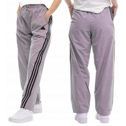 Adidas spodnie dresowe damskie sportowe treningowe Future Icons. Fioletowe obuwie sportowe damskie Adidas, bez wzorów, z dresówki, bez zapięcia, na fitness i siłownię. Za 229.99 zł.