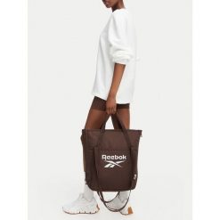 Torebka Reebok. Brązowe shopperki damskie Reebok, bez wzorów, bez dodatków. Za 129.99 zł.