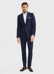 PAKO LORENTE – Wełniane spodnie garniturowe w kolorze granatowym. Eleganckie spodnie męskie Pako Lorente, m, bez wzorów, z wełny, biznesowe. Za 799.99 zł.