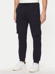 Guess Spodnie dresowe Z4YB08 K9V31 Granatowy Regular Fit. Niebieskie spodnie sportowe męskie Guess, m, z aplikacjami, z bawełny. Za 319.99 zł.