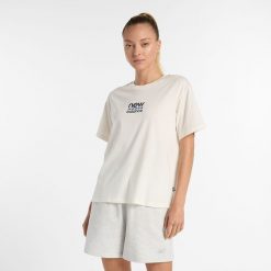 Koszulka damska New Balance WT51541SST – beżowa. Brązowe bluzki damskie New Balance, s, bez wzorów, z bawełny, eleganckie, bez kołnierzyka, bez ramiączek. Za 79.99 zł.