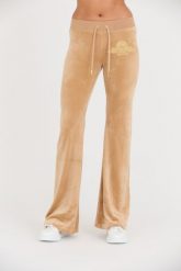 JUICY COUTURE Beżowe spodnie Arched Metallic Layla. Brązowe spodnie dresowe damskie Juicy Couture, bez wzorów, z dresówki. W wyprzedaży za 349.99 zł.