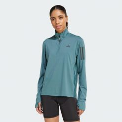 Kurtka Own the Run Half-Zip. Niebieskie kurtki sportowe damskie Adidas, xs, bez wzorów, z materiału, bez ramiączek, bez kaptura, do biegania. Za 203.25 zł.