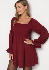 Bordowa Rozkloszowana Sukienka z Elastyczną Górą i Falbankami przy Rękawach Saviella. Czerwone sukienki damskie Born2be, na co dzień, bez wzorów, z jeansu, eleganckie, bez kołnierzyka, bez ramiączek, mini, rozkloszowane. Za 79.99 zł.