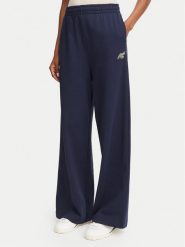 Lacoste Spodnie dresowe XF8392 Granatowy Flare Fit. Niebieskie spodnie dresowe damskie Lacoste, bez wzorów, z bawełny. Za 579.99 zł.
