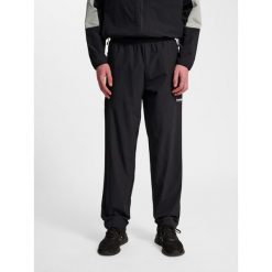 Spodnie do biegania Hummel Pulse. Czarne spodnie sportowe męskie Hummel, bez wzorów, z dresówki, do biegania. Za 267.00 zł.