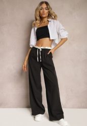 Czarne Materiałowe Spodnie z Szerokimi Nogawkami High Waist z Gumką w Talii Comina. Czarne spodnie materiałowe damskie Renee, bez wzorów, z jeansu, eleganckie, z podwyższonym stanem. Za 119.99 zł.