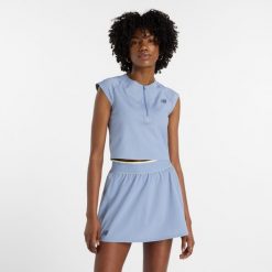 Koszulka damska New Balance WT43430DUS – niebieska. Niebieskie koszulki sportowe damskie New Balance, xs, bez wzorów, z materiału, bez ramiączek. Za 249.99 zł.