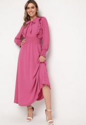 Ciemnoróżowa Rozkloszowana Sukienka Maxi Wiązana przy Dekolcie Ozdobiona Falbankami Nuteki. Czerwone sukienki damskie Born2be, na imprezę, m, bez wzorów, eleganckie, bez kołnierzyka, bez ramiączek, maxi, rozkloszowane. Za 109.99 zł.