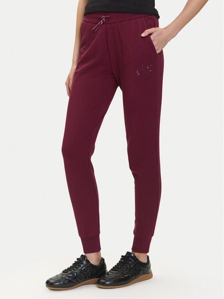 Armani Exchange Spodnie dresowe XW000986 AF16114 UA343 Bordowy Relaxed Fit. Czerwone spodnie dresowe damskie Armani Exchange, bez wzorów, z bawełny. Za 509.99 zł.