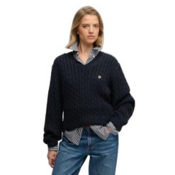 Damski oversize sweter z dekoltem w kształcie V Superdry. Niebieskie swetry nierozpinane damskie Superdry, na zimę, bez wzorów, eleganckie, bez kołnierzyka, bez ramiączek. Za 284.00 zł.