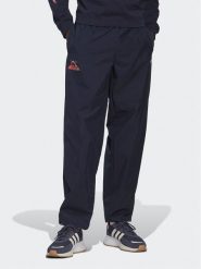 Adidas Spodnie dresowe Adventure Ride HK4979 Granatowy Loose Fit. Niebieskie spodnie sportowe męskie Adidas, l, bez wzorów, z dresówki. Za 229.99 zł.