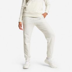 Spodnie dresowe damskie. Szare spodnie dresowe damskie DOMYOS, bez wzorów, z bawełny, sportowe, na jogę i pilates. Za 99.99 zł.