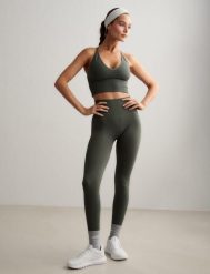 Damskie legginsy invisible scrunch, squat proof Shape Seamless zielone. Zielone legginsy damskie Aim'n, bez wzorów, z dzianiny. Za 296.00 zł.