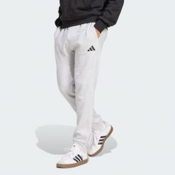 Spodnie polarowe Essentials Feelcozy. Czarne buty sportowe męskie Adidas, bez wzorów, z polaru, eleganckie. Za 219.00 zł.