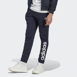 Spodnie dresowe męskie adidas Essentials Single Jersey Tapered Elasticized Cuff. Niebieskie buty sportowe męskie Adidas, m, bez wzorów, z dresówki, na fitness i siłownię. Za 159.00 zł.