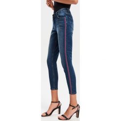 Jeansy slim z lampasem - Granatowy. Jeansy damskie marki Reserved. Za 69.99 zł.