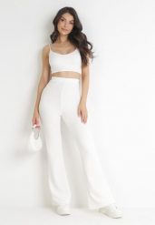 Białe Spodnie Dzwony z Gumką w Pasie Milica. Białe spodnie materiałowe damskie Born2be, bez wzorów, z jeansu, eleganckie, z podwyższonym stanem. Za 99.99 zł.