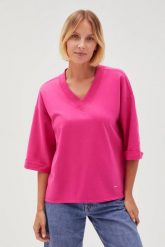 Bluza oversize z dekoltem w serek fuksjowa. Bluzy damskie MOODO, l, bez wzorów, z bawełny, bez ramiączek, bez kaptura. Za 79.99 zł.