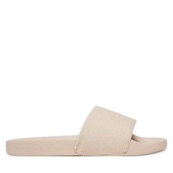 Klapki Calvin Klein Jeans. Brązowe klapki damskie Calvin Klein Jeans, bez wzorów, z jeansu, bez obcasa, bez zapięcia. Za 109.99 zł.