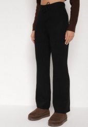 Czarne Prążkowane Spodnie z Wełną o Szerokim Kroju z Wysokim Stanem Reinnia. Czarne spodnie materiałowe damskie Born2be, bez wzorów, z jeansu, z podwyższonym stanem. Za 69.99 zł.