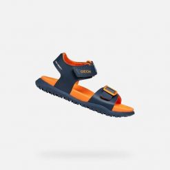 Sandały GEOX J SANDAL FUSBETTO BO Niebieski. Brązowe sandały męskie Geox, na lato, bez wzorów, ze skóry, bez zapięcia. Za 188.99 zł.