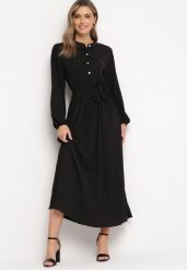 Czarna Rozkloszowana Sukienka Maxi z Plisowanym Dołem i Wiązanym Paskiem Nollira. Czarne sukienki damskie Born2be, bez wzorów, eleganckie, bez kołnierzyka, bez ramiączek, maxi, plisowane. Za 119.99 zł.