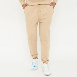 Spodnie sportowe unisex F BALLON beżowe. Brązowe buty sportowe męskie Legea, bez wzorów, z gumy, na fitness i siłownię. W wyprzedaży za 92.00 zł.