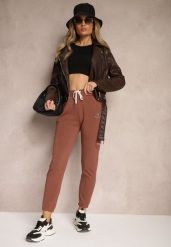 Brązowe Klasyczne Spodnie Dresowe z Elastyczną Gumką w Pasie Lerinde. Brązowe spodnie dresowe damskie Renee, bez wzorów, z dresówki, klasyczne. Za 44.99 zł.