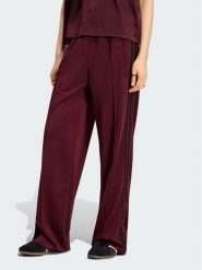 Adidas Spodnie dresowe Firebird Loose Tracksuit KS4669 Bordowy Loose Fit. Czerwone spodnie dresowe damskie Adidas, bez wzorów, z dresówki. Za 298.99 zł.