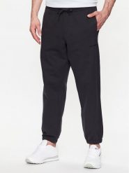New Balance Spodnie dresowe MP23551 Czarny Relaxed Fit. Czarne spodnie sportowe męskie New Balance, l, bez wzorów, z bawełny. Za 279.99 zł.