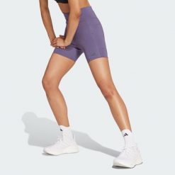 Legginsy Own the Run Short. Fioletowe szorty damskie Adidas, bez wzorów, z materiału, sportowe. W wyprzedaży za 170.82 zł.