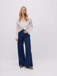 Jeansy wide leg z przeszyciami - granatowy. Niebieskie jeansy damskie Reserved, bez wzorów, z bawełny, z podwyższonym stanem. W wyprzedaży za 89.99 zł.
