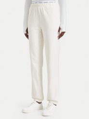 Guess Spodnie dresowe O5RB01 KCO31 Kremowy Regular Fit. Białe spodnie dresowe damskie Guess, z aplikacjami, z bawełny. Za 264.99 zł.