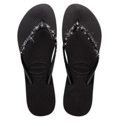 Klapki Havaianas Model Slim Glitter Ii Kolor Czarny. Czarne klapki damskie Havaianas, bez wzorów, z gumy, casualowe, bez obcasa, bez zapięcia. Za 158.90 zł.