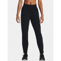 Spodnie sportowe damskie Under Armour UA OutRun the Storm. Czarne spodnie dresowe damskie Under Armour, bez wzorów, sportowe, do biegania. Za 239.99 zł.