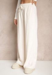 Białe Spodnie o Szerokim Kroju High Waist z Wiązaniem w Pasie Ettianne. Białe spodnie materiałowe damskie Renee, bez wzorów, z jeansu, eleganckie, z podwyższonym stanem. Za 44.99 zł.